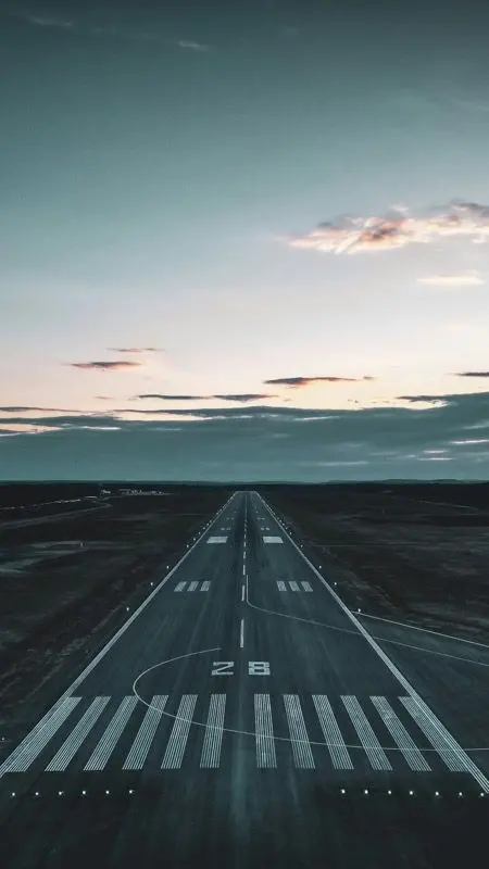 Airport runway at dusk seen from above